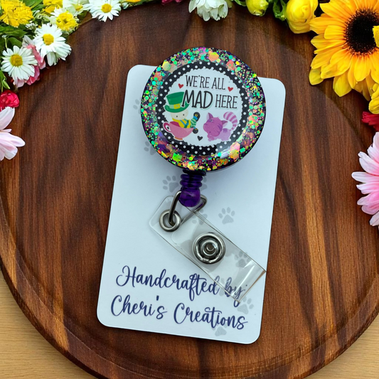 We’re All Mad Here Badge Reel – Spooky Wonderland-Inspired ID Holder with Cheshire Smile Design