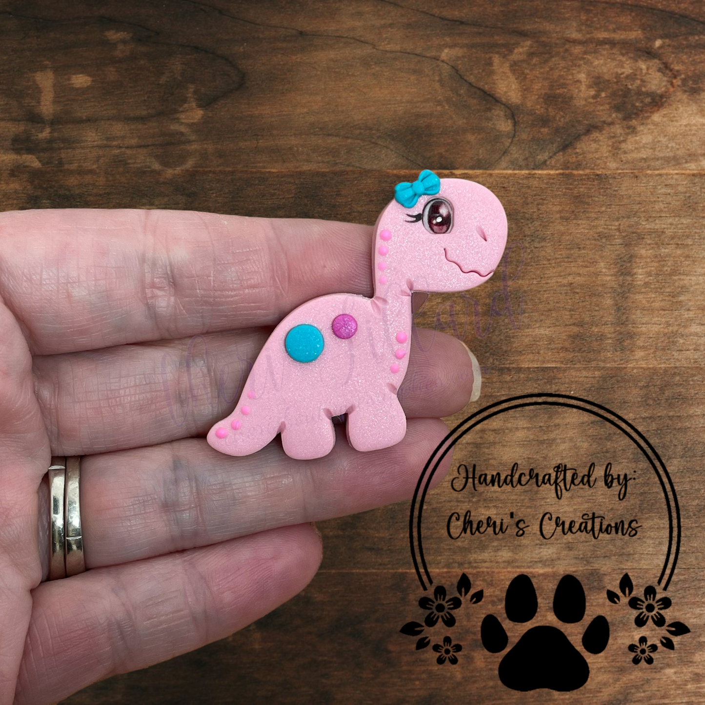 Pink Dino Bow Center – Handmade Polymer Clay Embellishment