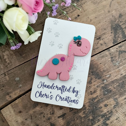Pink Dino Bow Center – Handmade Polymer Clay Embellishment