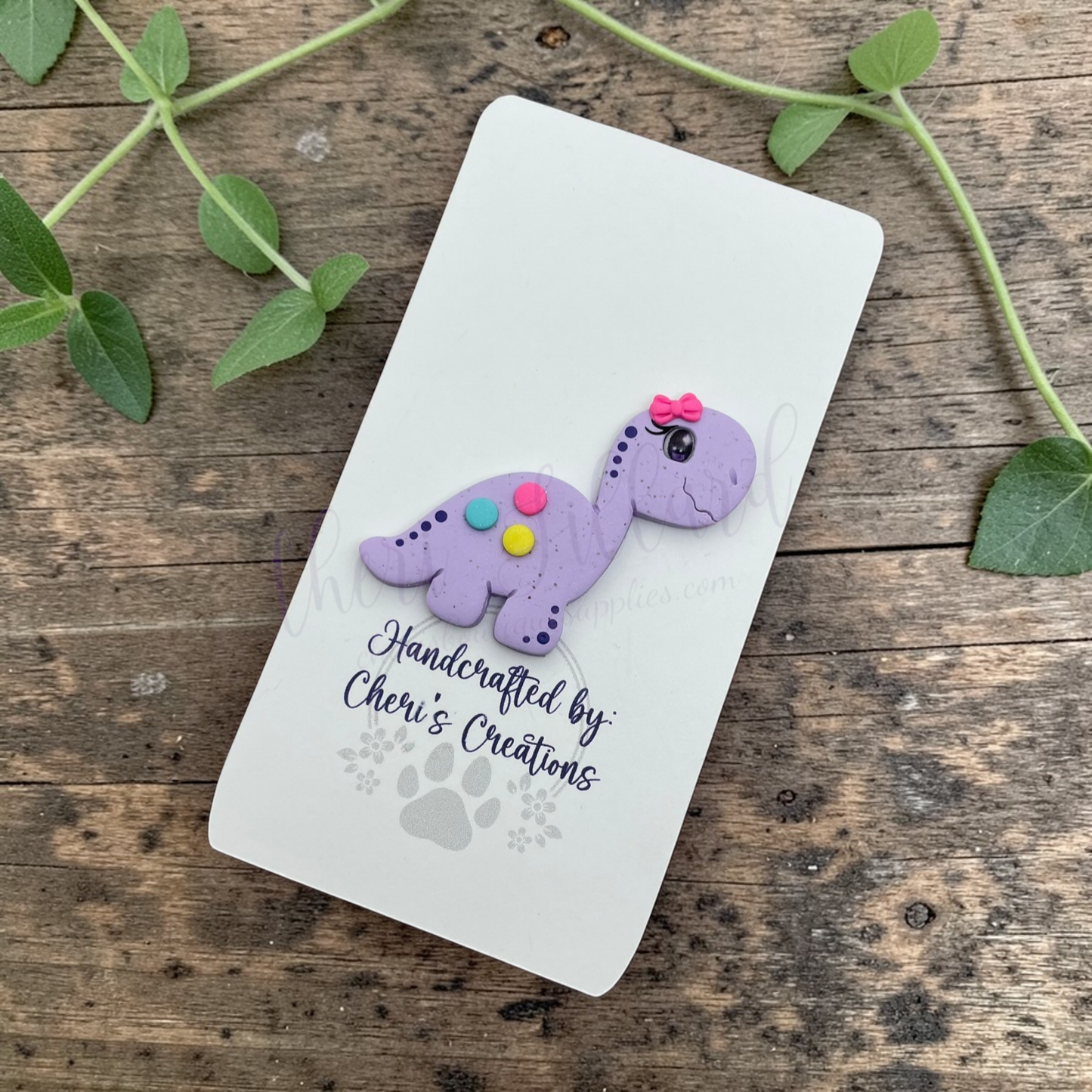 Purple Dino Bow Center – Handmade Polymer Clay Embellishment