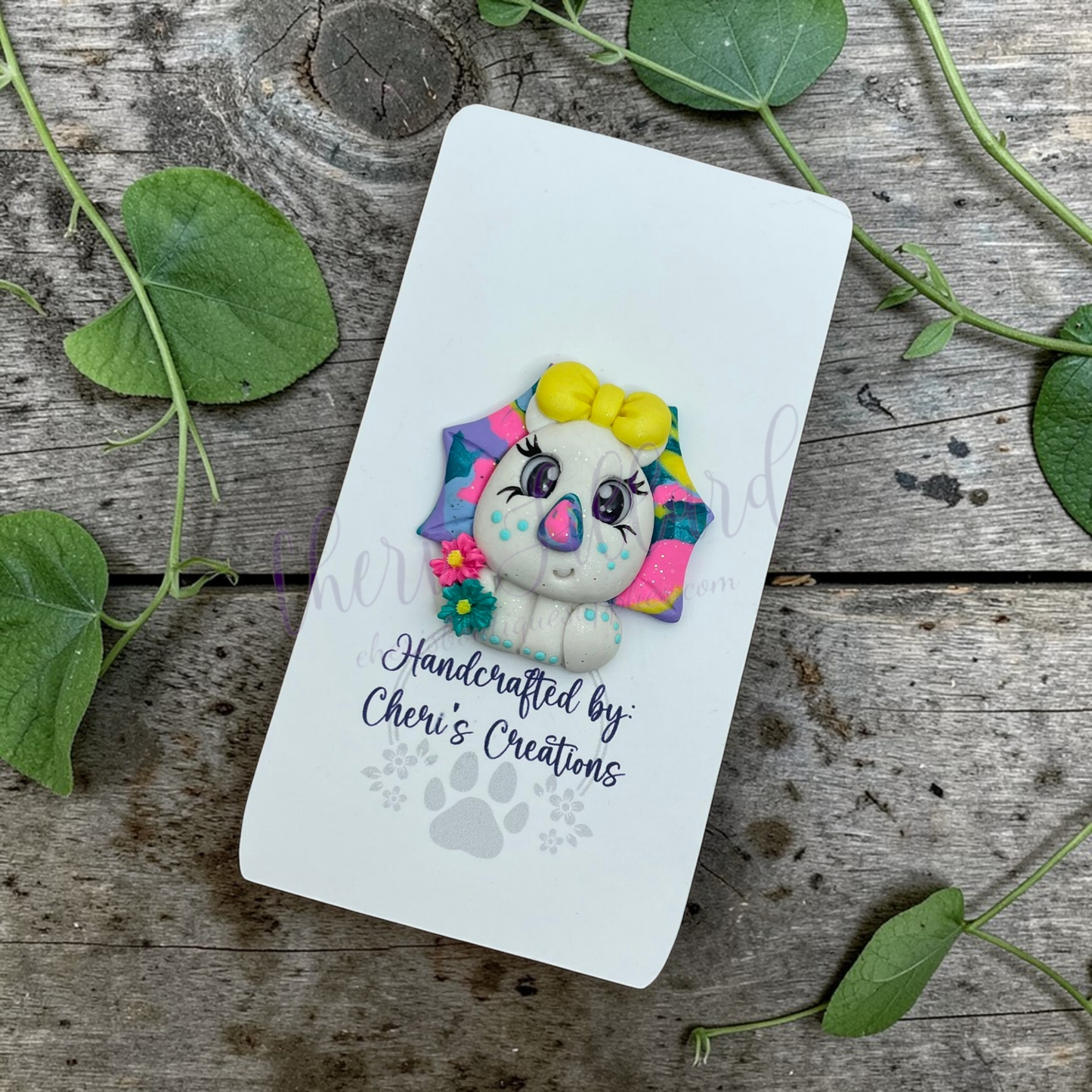 Rainbow Triceratops Bow Center – Handmade Polymer Clay Embellishment