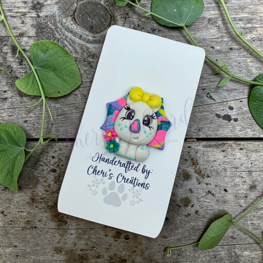 Rainbow Triceratops Bow Center – Handmade Polymer Clay Embellishment