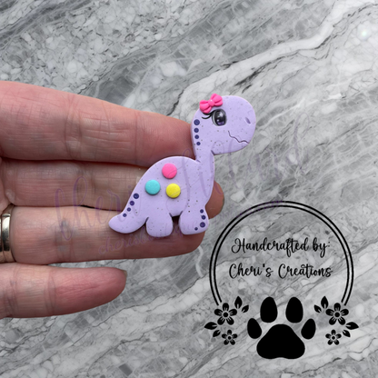 Purple Dino Bow Center – Handmade Polymer Clay Embellishment