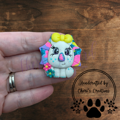 Rainbow Triceratops Bow Center – Handmade Polymer Clay Embellishment